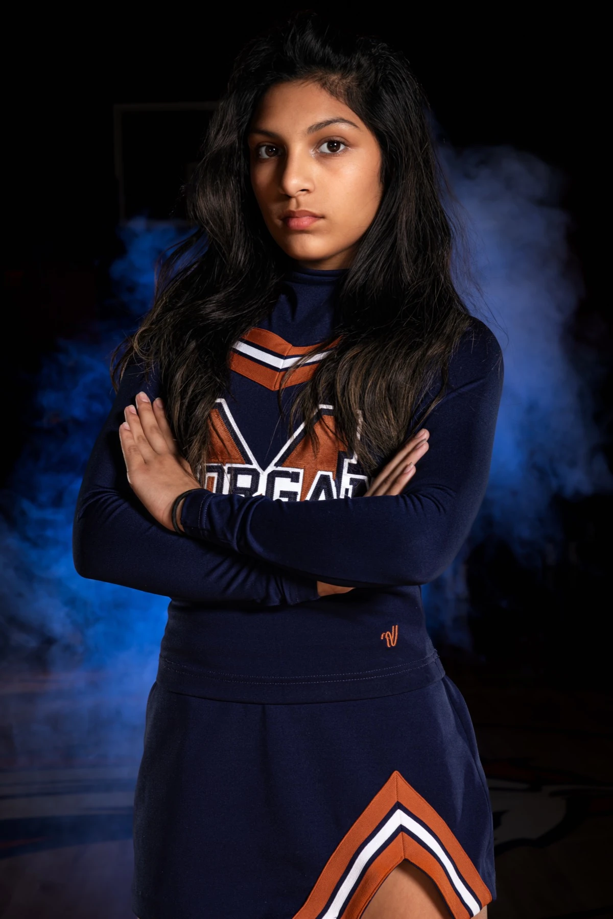 Morgan cheerleader with blue smoke